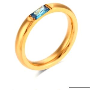 Elegant Gold Ring with Blue Stone